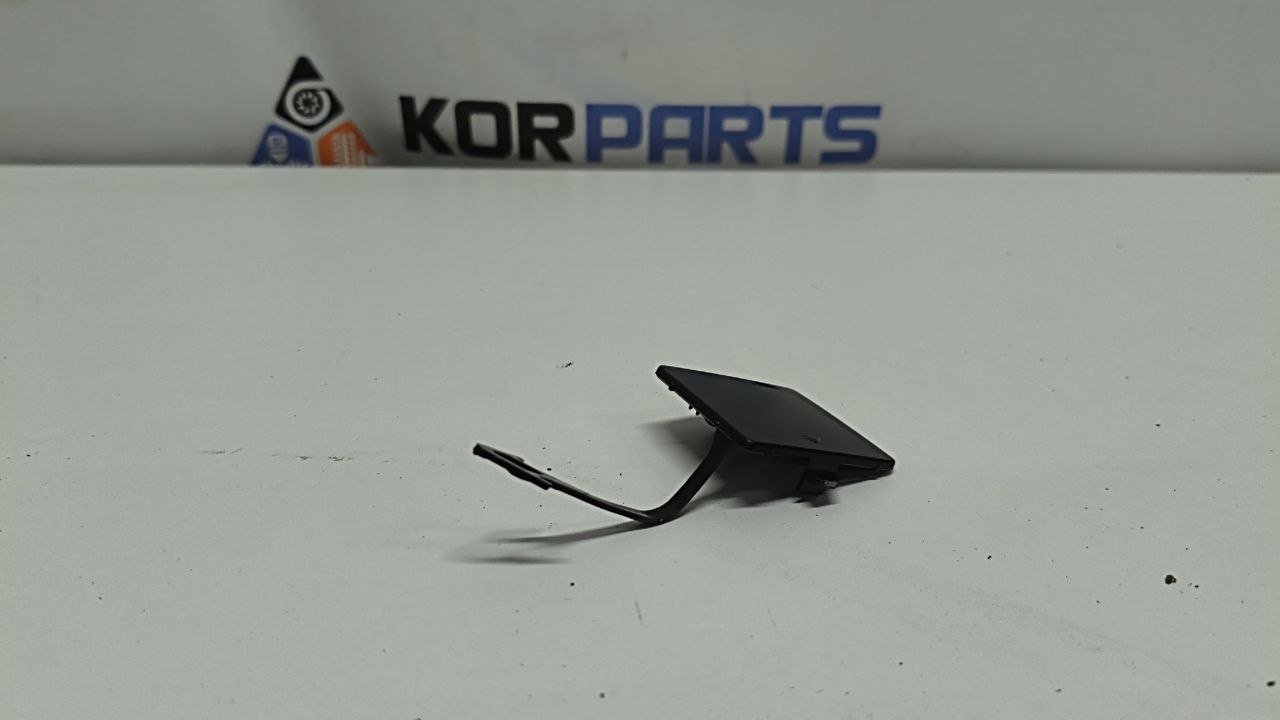 YtGM2ycYFWTiiFPjbSkYmhXeHb8YEmKL Заглушка буксирувального гака, передня Hyundai IONIQ 5 Front Bumper Tow Hook Cover 86589GI000 - Зображення 1