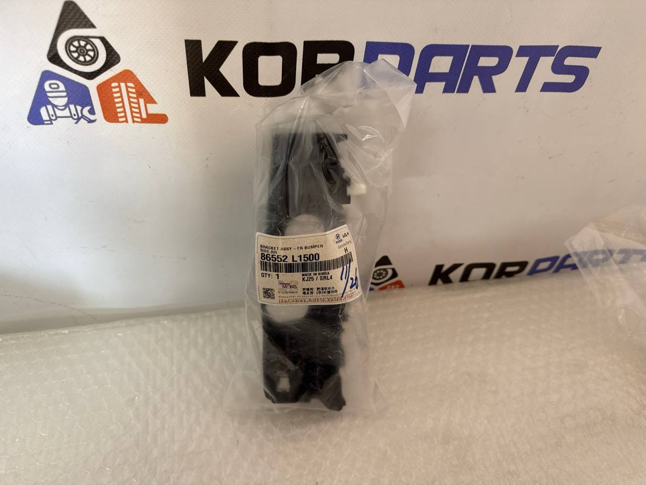 agacagiaaxkbaairsmlu Універсальна деталь BRACKET ASSY-FR BUMPER SIDE,RH Кронштейн бічний переднього бампера, правий 86552l1500 - Зображення 1